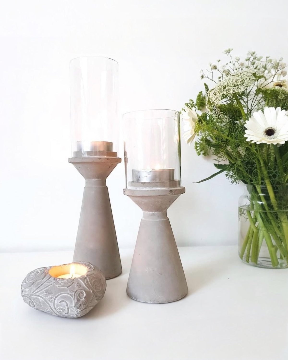 Satchville stone hurricane tealight candle holders in a small, decorative home decor style with natural stone finish.