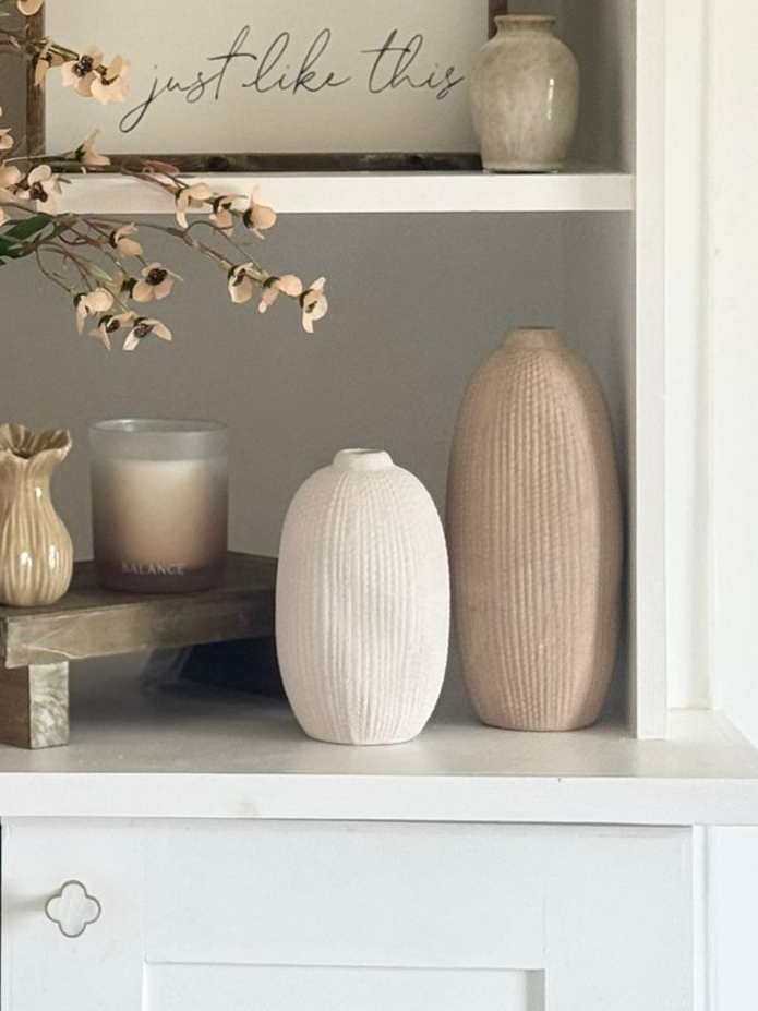 Tall beige textured stone vase by Satchville with a neutral ribbed surface, perfect for displaying flowers or decorative arrangements.