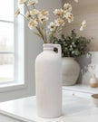 Tall white textured vase by Satchville, featuring a sleek cylindrical design and subtle surface pattern.