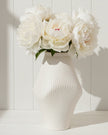 Medium neutral ceramic vase with sculptural ribbed design by Satchville, showcasing modern decorative vase style.