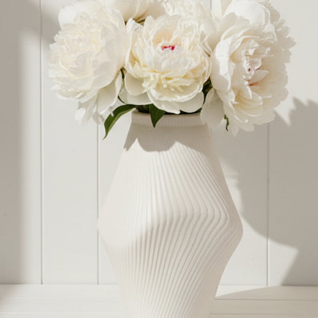 Medium neutral ceramic vase with sculptural ribbed design by Satchville, showcasing modern decorative vase style.