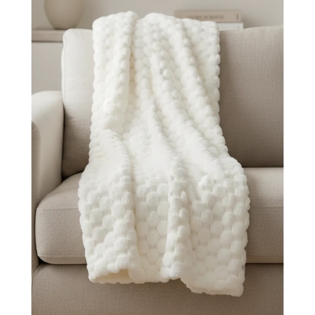 Ivory white Malini Sculpted Faux Bunny Rabbit Throw Blanket made of soft furnishings material, featuring a textured bunny design.