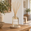 Heaven Scent SEA SALT & SPRAY 100ml reed diffuser styled on an oak console with natural reeds inserted.