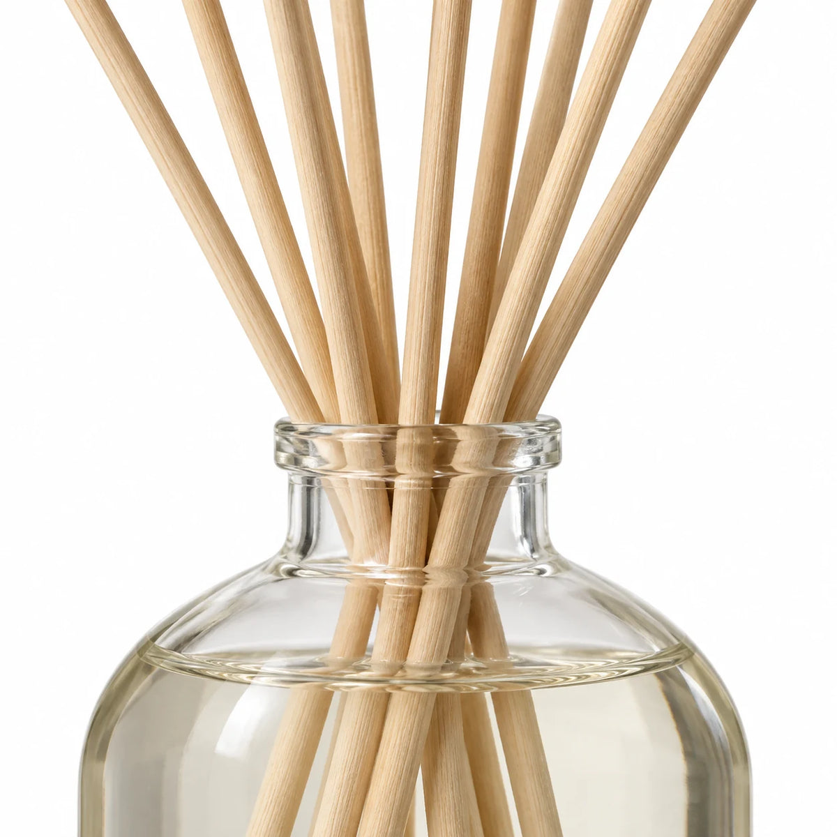 Heaven Scent SEA SALT & SPRAY 100ml reed diffuser close-up of natural rattan reeds and the glass bottle neck.