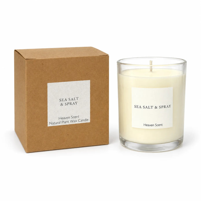 Heaven Scent Sea Salt & Spray Medium Candle, unlit with its brown kraft box against white