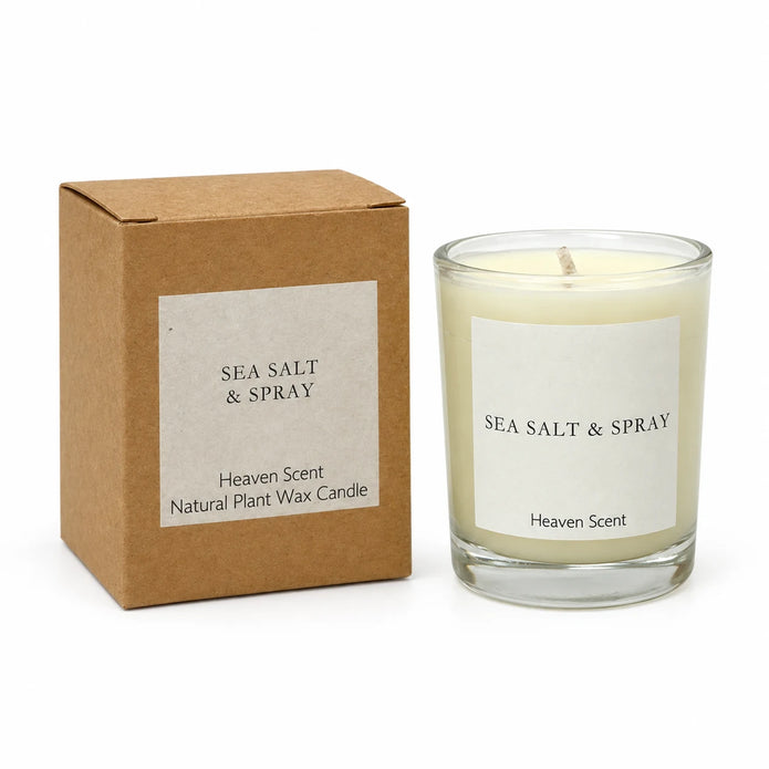 Heaven Scent Sea Salt & Spray Small Candle, unlit with its brown kraft box against white