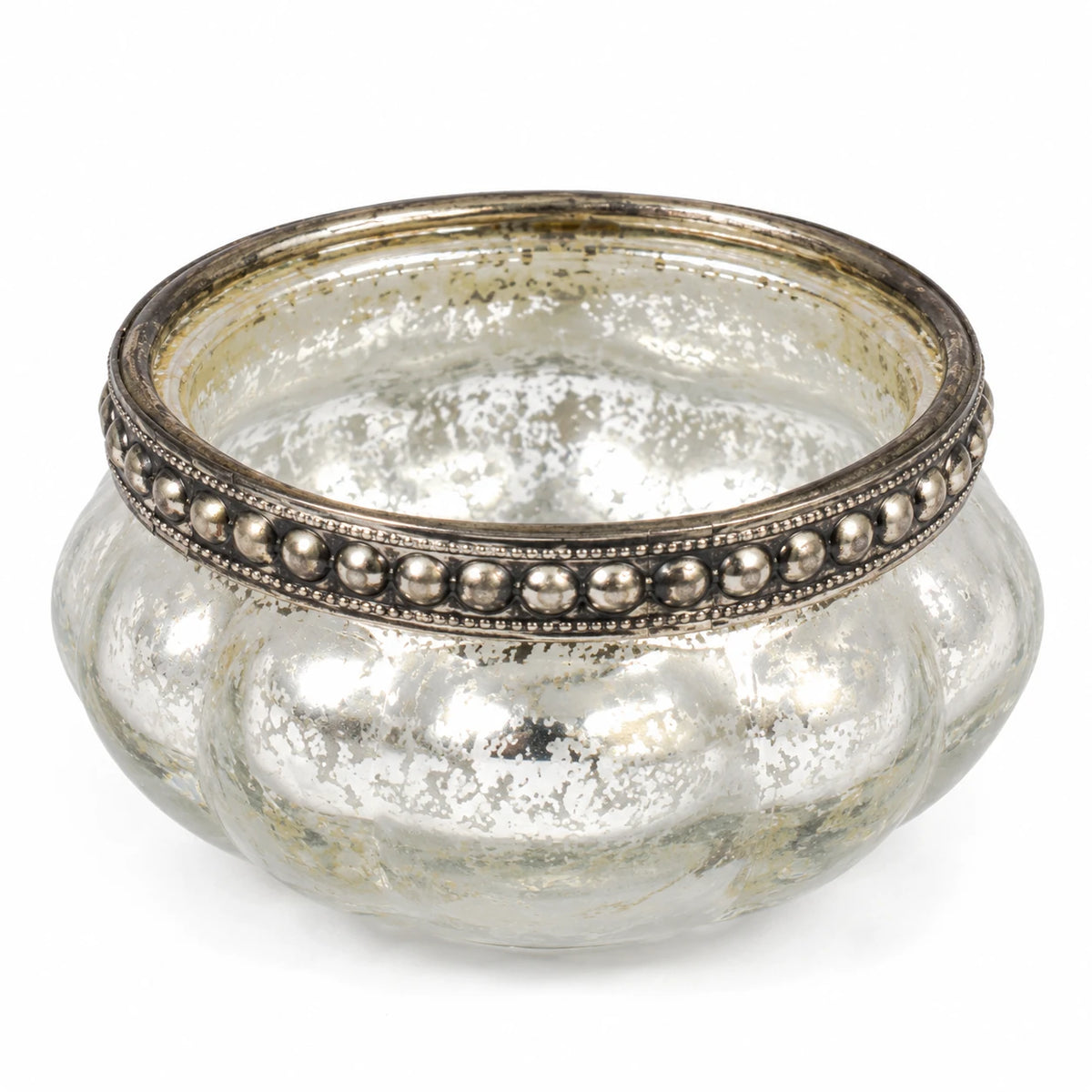 Close-up of the empty silver glass tealight holder showing its beaded metal rim and mottled finish.
