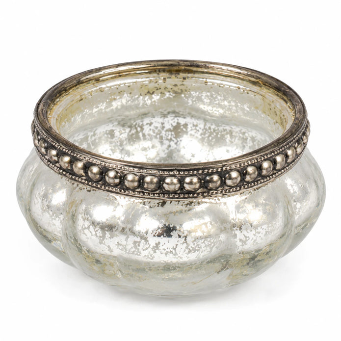 Close-up of the empty silver glass tealight holder showing its beaded metal rim and mottled finish.
