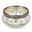 Close-up of the empty silver glass tealight holder showing its beaded metal rim and mottled finish.