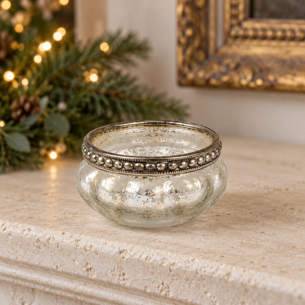 Originals International Ltd glass silver bead tealight holder on a mantelpiece
