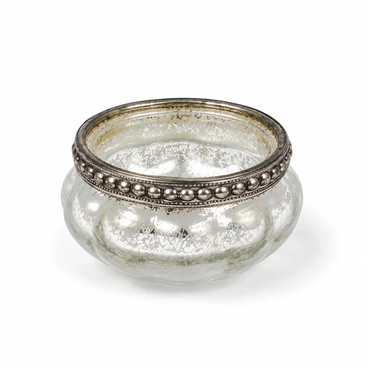 One empty silver glass tealight holder photographed on white.