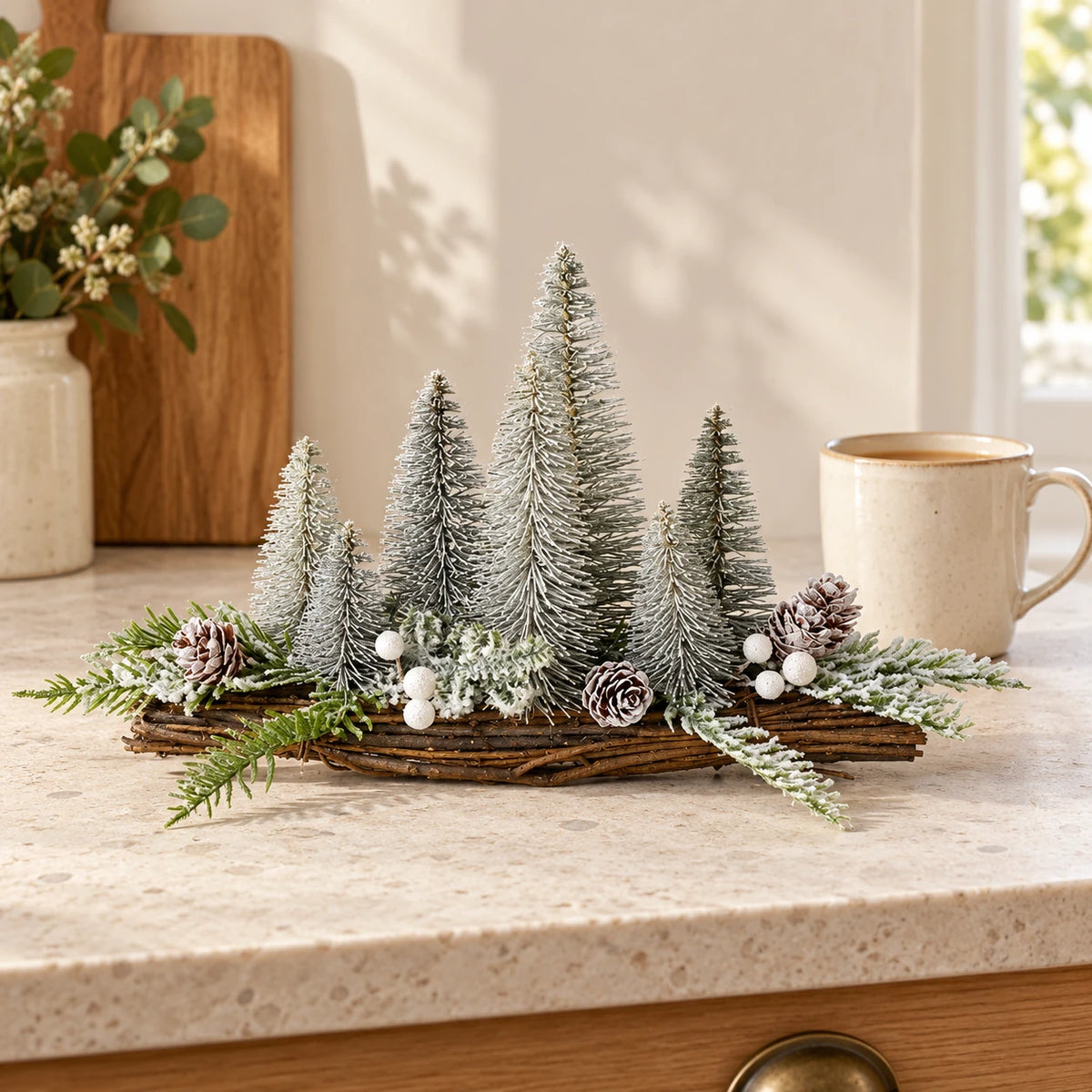 Silver fir Christmas tree decoration by Heaven Sends on a kitchen scale