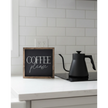 Small black framed sign with 