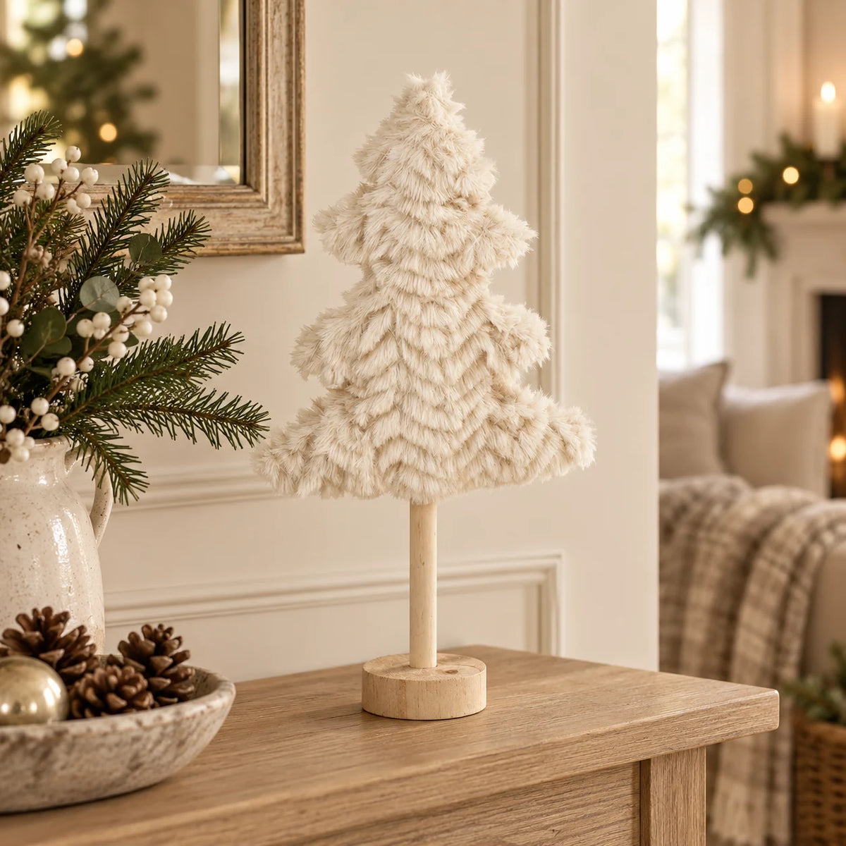 Small cream fluffy tree on an oak console.