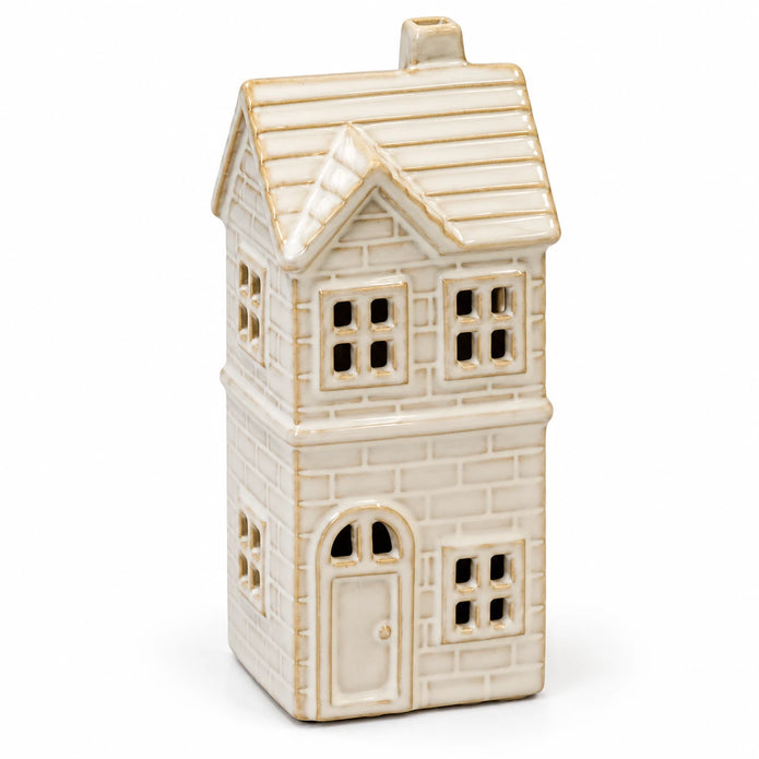 Close view of the ivory glaze and brick detail of the unlit ceramic LED house