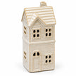 Close view of the ivory glaze and brick detail of the unlit ceramic LED house