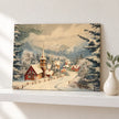 Snowy Village printed canvas board on a white picture shelf in a neutral home.