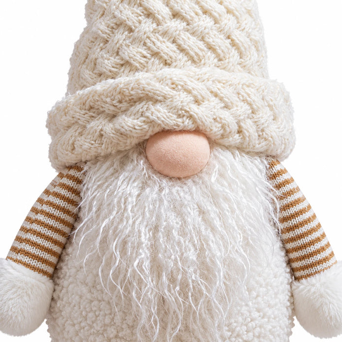 Close-up of the snowy white gonk's knitted hat, nose and textured beard.