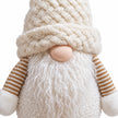 Close-up of the snowy white gonk's knitted hat, nose and textured beard.