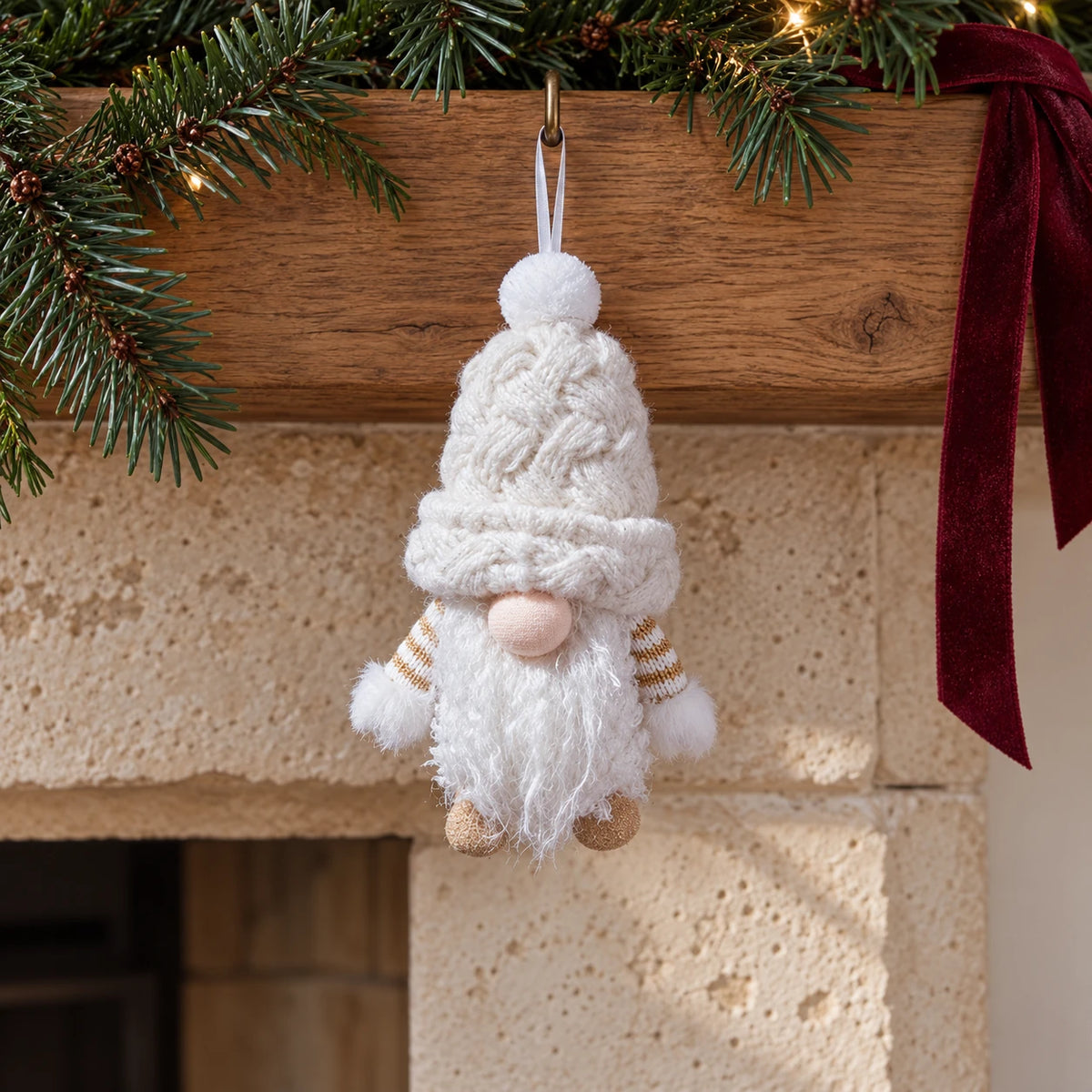 Snowy white hanging gonk displayed beneath an oak Christmas mantel.