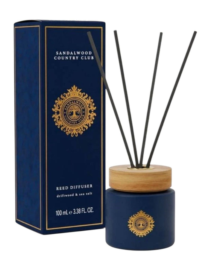Somerset Toiletries Sandalwood Country Club navy blue diffuser with driftwood and seasalt scent, decorative bottle and diffuser sticks.