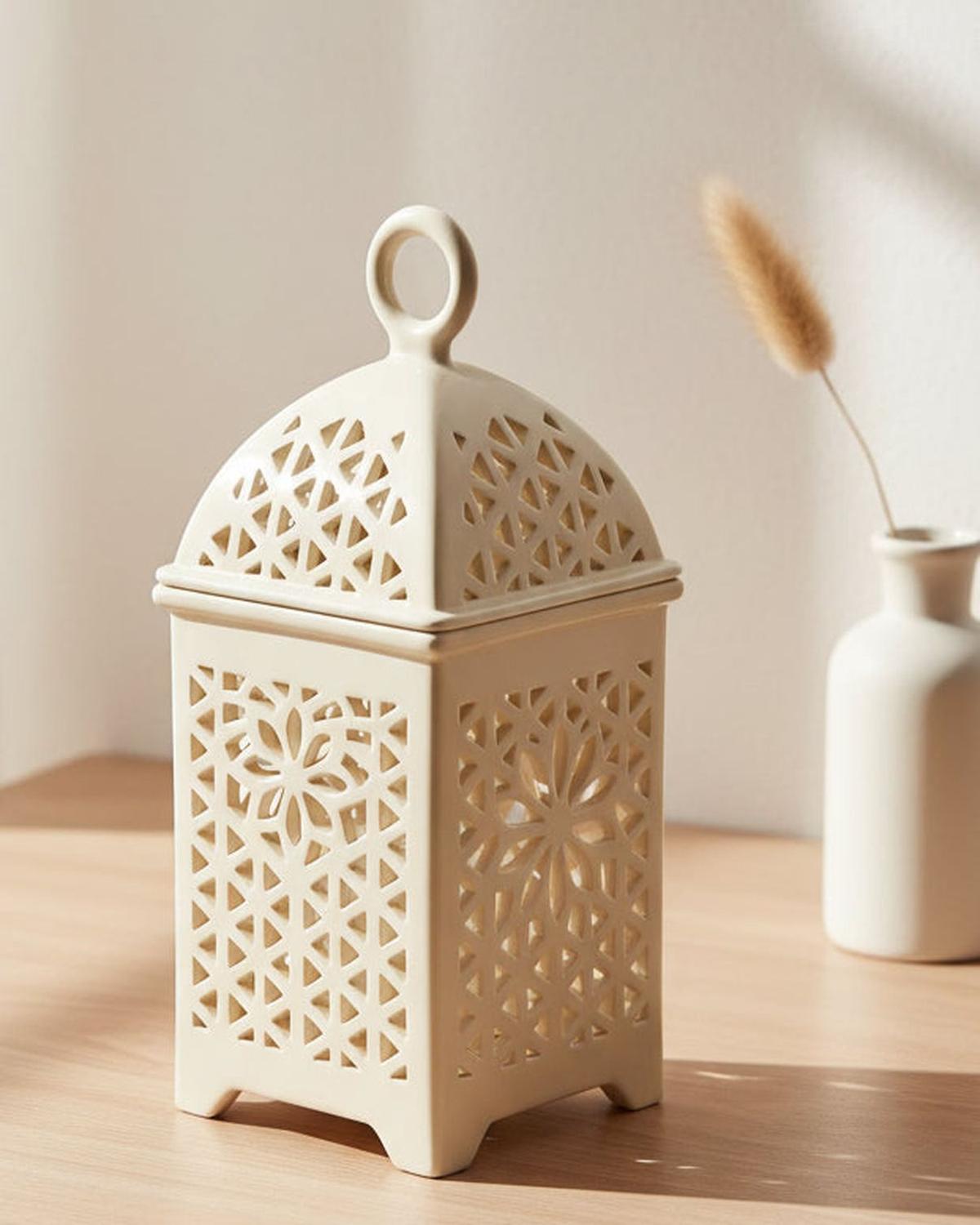 Neutral ceramic lantern-style wax burner with a classic design, perfect for adding a warm ambiance to any space.
