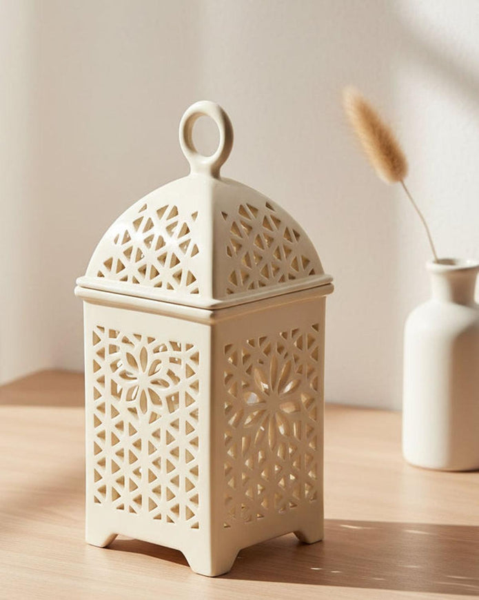 Neutral ceramic lantern-style wax burner with a classic design, perfect for adding a warm ambiance to any space.