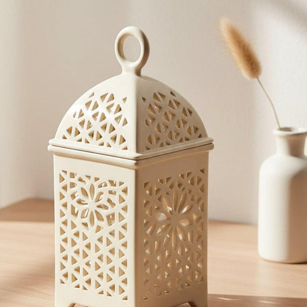 Neutral ceramic lantern-style wax burner with a classic design, perfect for adding a warm ambiance to any space.