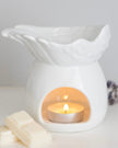 White ceramic angel wings dish wax melt burner for candles and wax melts, featuring a decorative angel wing design.
