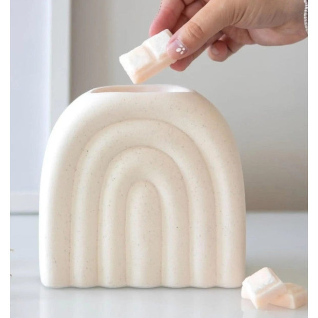 Cream arch wax melt oil burner, decorative ceramic wax melt warmer with a smooth curved design, by Something Different Wholesale.