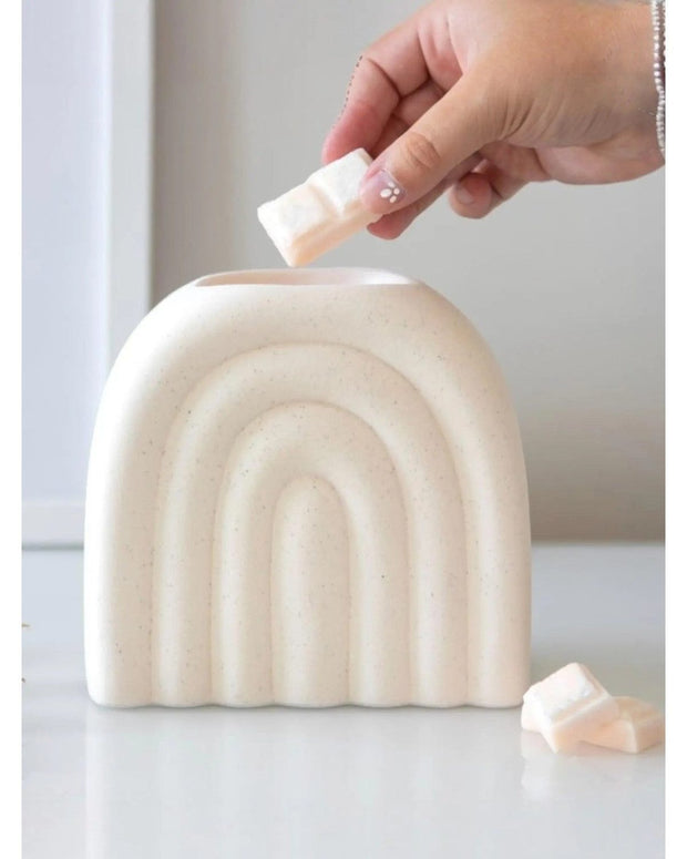 Cream arch-shaped wax melt oil burner with decorative design, perfect for aromatherapy and home fragrance.