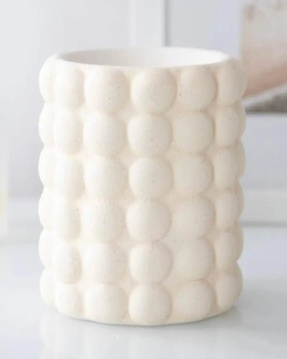 Cream Bubble Wax Melt Oil Burner from Something Different Wholesale, ceramic design with a rounded bubble pattern.