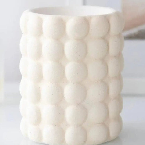 Cream Bubble Wax Melt Oil Burner from Something Different Wholesale, ceramic design with a rounded bubble pattern.