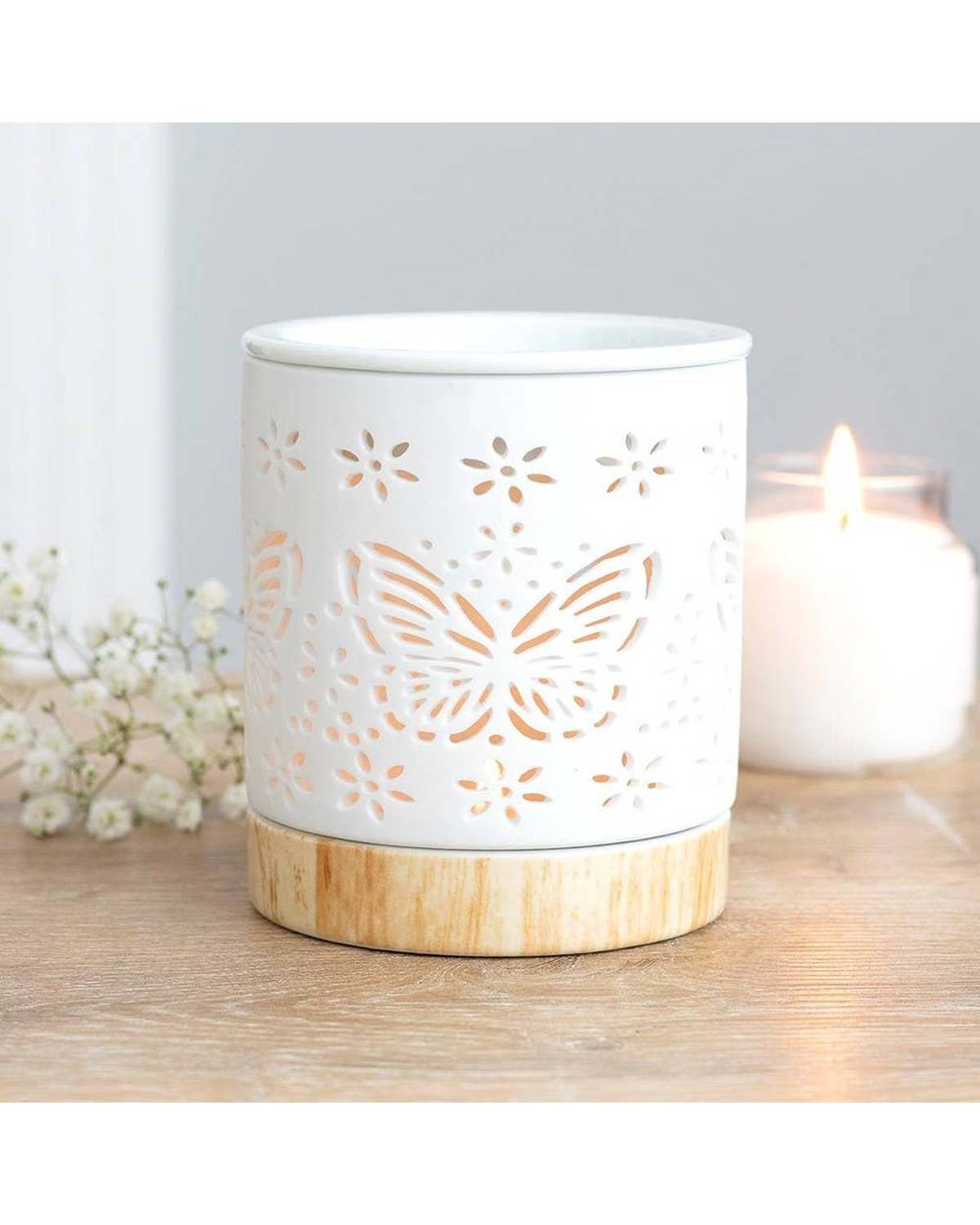 Matte ceramic butterfly-shaped wax melt warmer and oil burner for aromatic fragrances and essential oils.