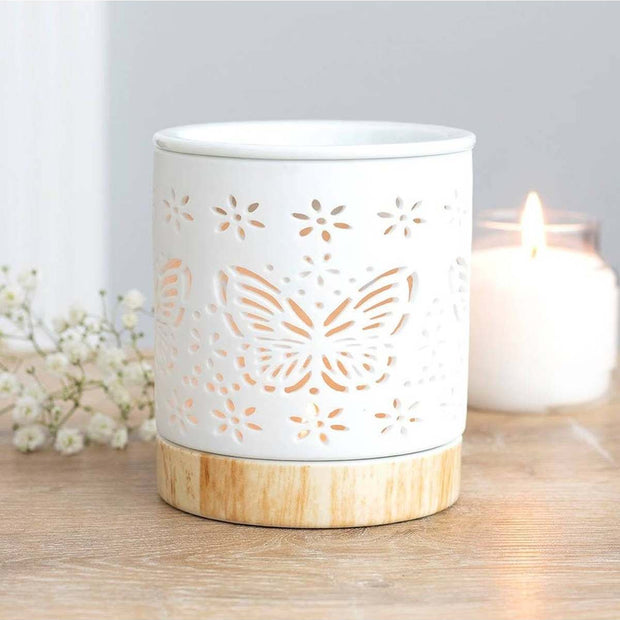 Matte ceramic butterfly-shaped wax melt warmer and oil burner for aromatic fragrances and essential oils.