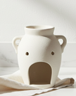 Vase-shaped oil burner and wax warmer from Something Different Wholesale, decorative wax melt burner with a sleek design.
