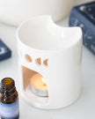 White crescent moon wax melt burner with a smooth, curved design, perfect for essential oils and fragrance melts.