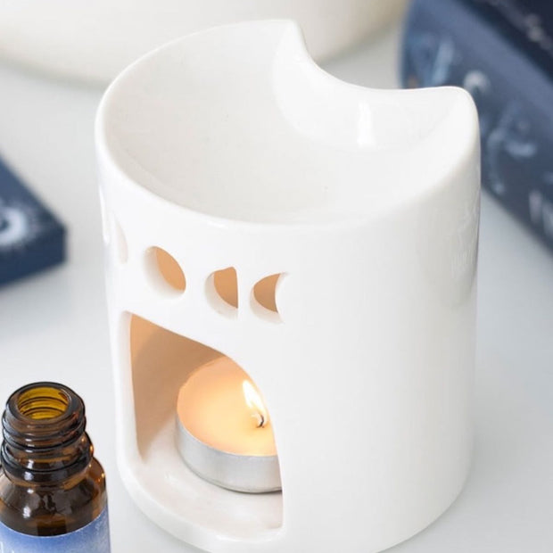 White crescent moon wax melt burner with a smooth, curved design, perfect for essential oils and fragrance melts.