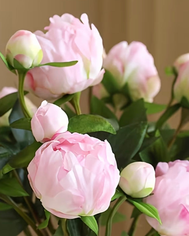 Artificial luxury pale pink double peony flower stem from Starlight Express, showcasing soft pink petals and realistic greenery.