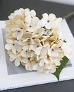 Artificial short soft cream hydrangea stem from Starlight Express, realistic faux floral plant for home decor.