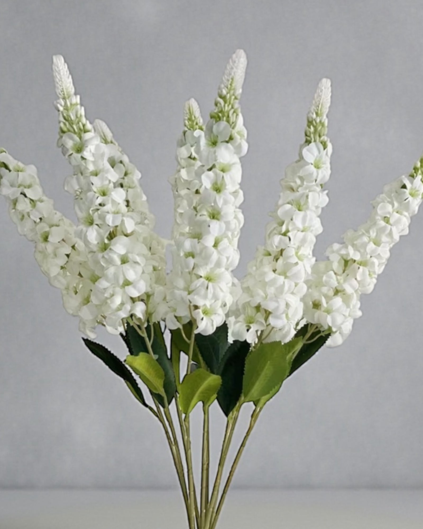 Artificial tall white lupin stem from Starlight Express, realistic white flowers on a long, slender green stem for decorative use.