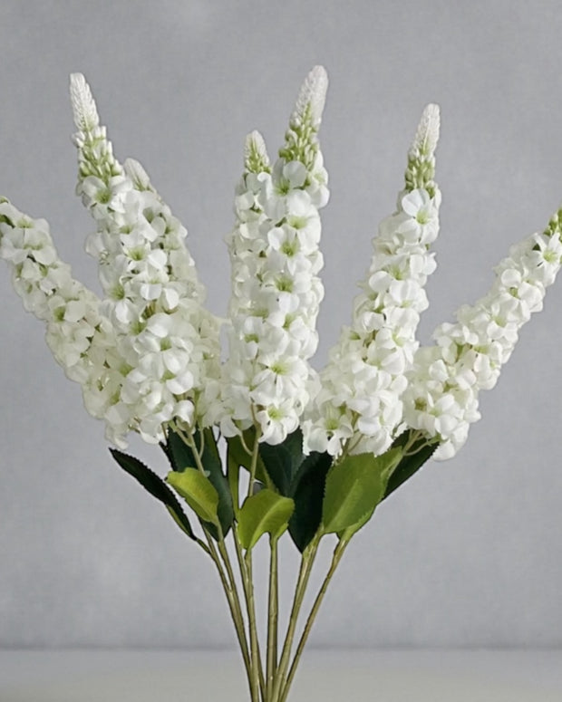 Artificial tall white lupin stem from Starlight Express, realistic white flowers on a long, slender green stem for decorative use.