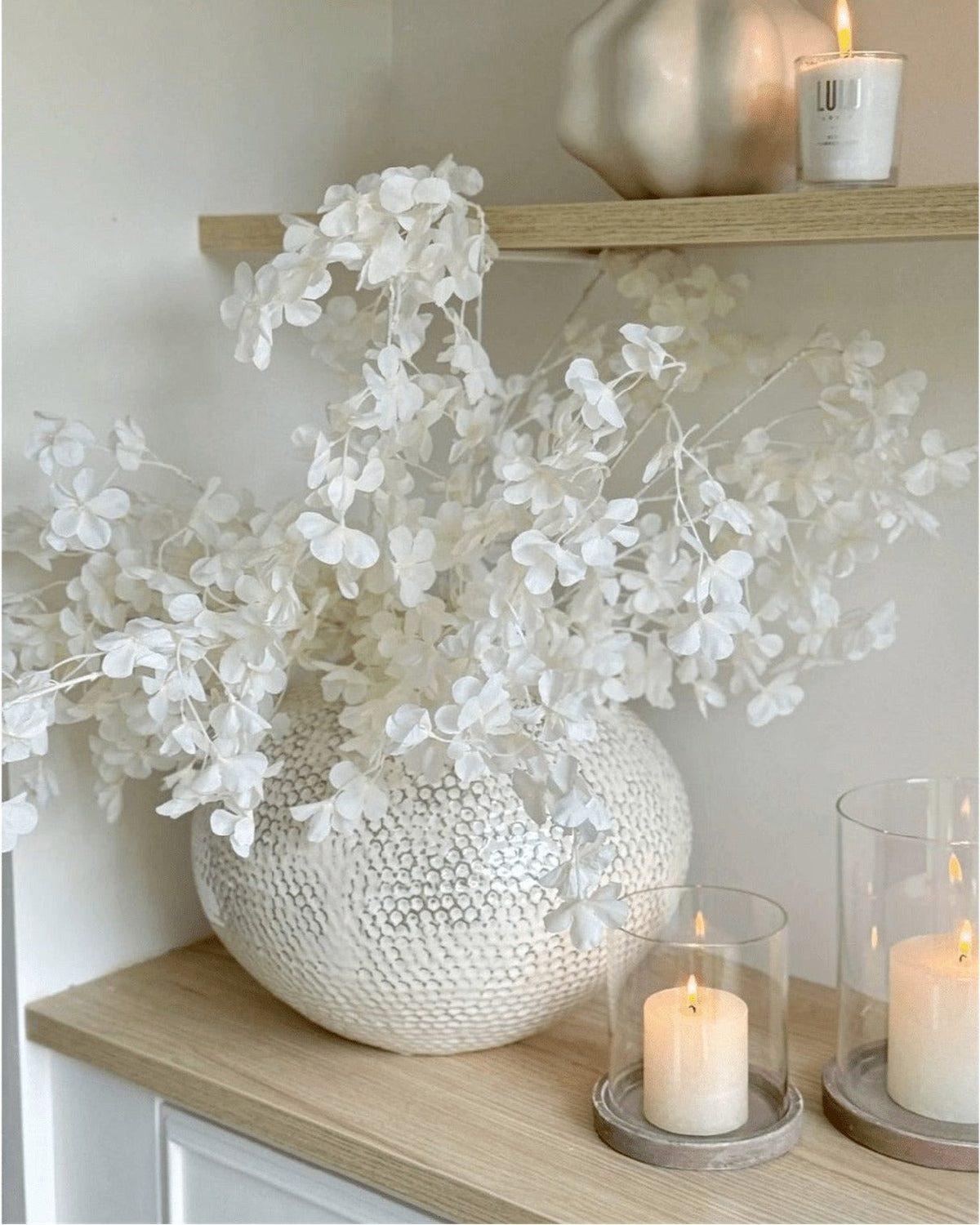 Artificial white blossom stem from Starlight Express, featuring delicate white flowers on a realistic plant stem.