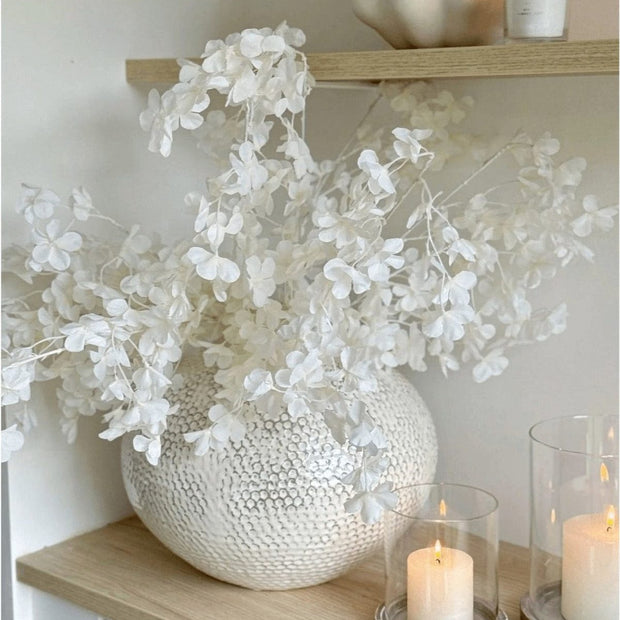 Artificial white blossom stem from Starlight Express, featuring delicate white flowers on a realistic plant stem.