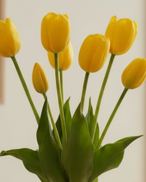 Yellow artificial tulip stems in a bunch of five from Starlight Express, perfect for spring floral decor.