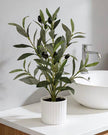 Small potted artificial olive tree from Starlight Express with realistic green leaves in a compact pot.