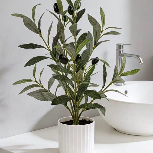Small potted artificial olive tree from Starlight Express with realistic green leaves in a compact pot.
