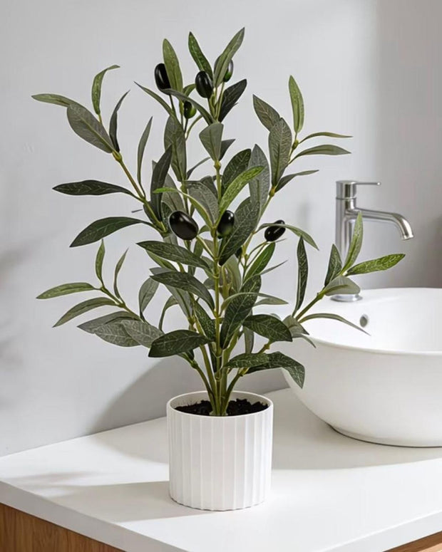 Small potted artificial olive tree from Starlight Express with realistic green leaves in a compact pot.