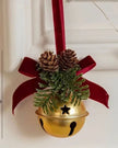 Gold Christmas bell with a burgundy bow, from Starlight Express, hanging as a festive holiday decoration.
