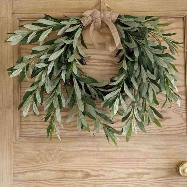 Faux olive stem wreath with realistic green foliage, perfect for decorating walls or doors in a natural style.